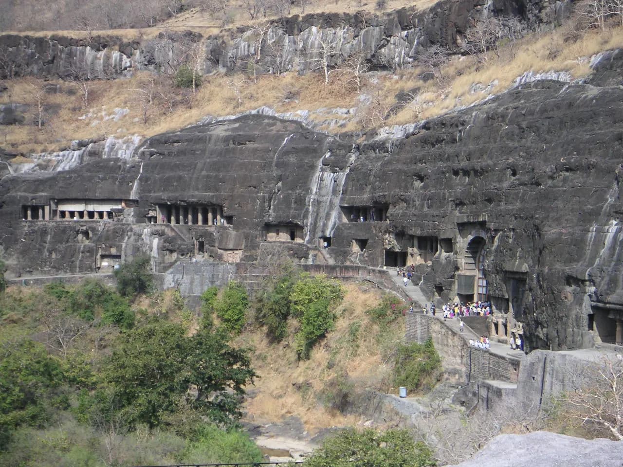 The horseshoe cliff of rock-cut Buddhist caves above the Waghora river gorge at Ajanta