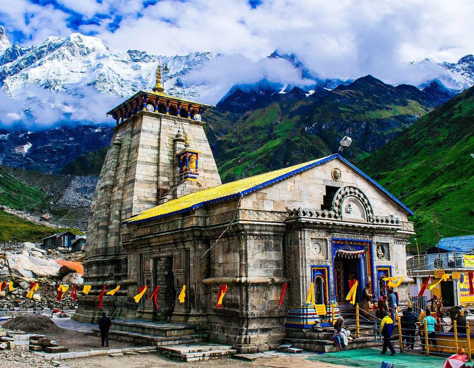 Kedarnath temple in stone below the snow-covered Kedarnath dome