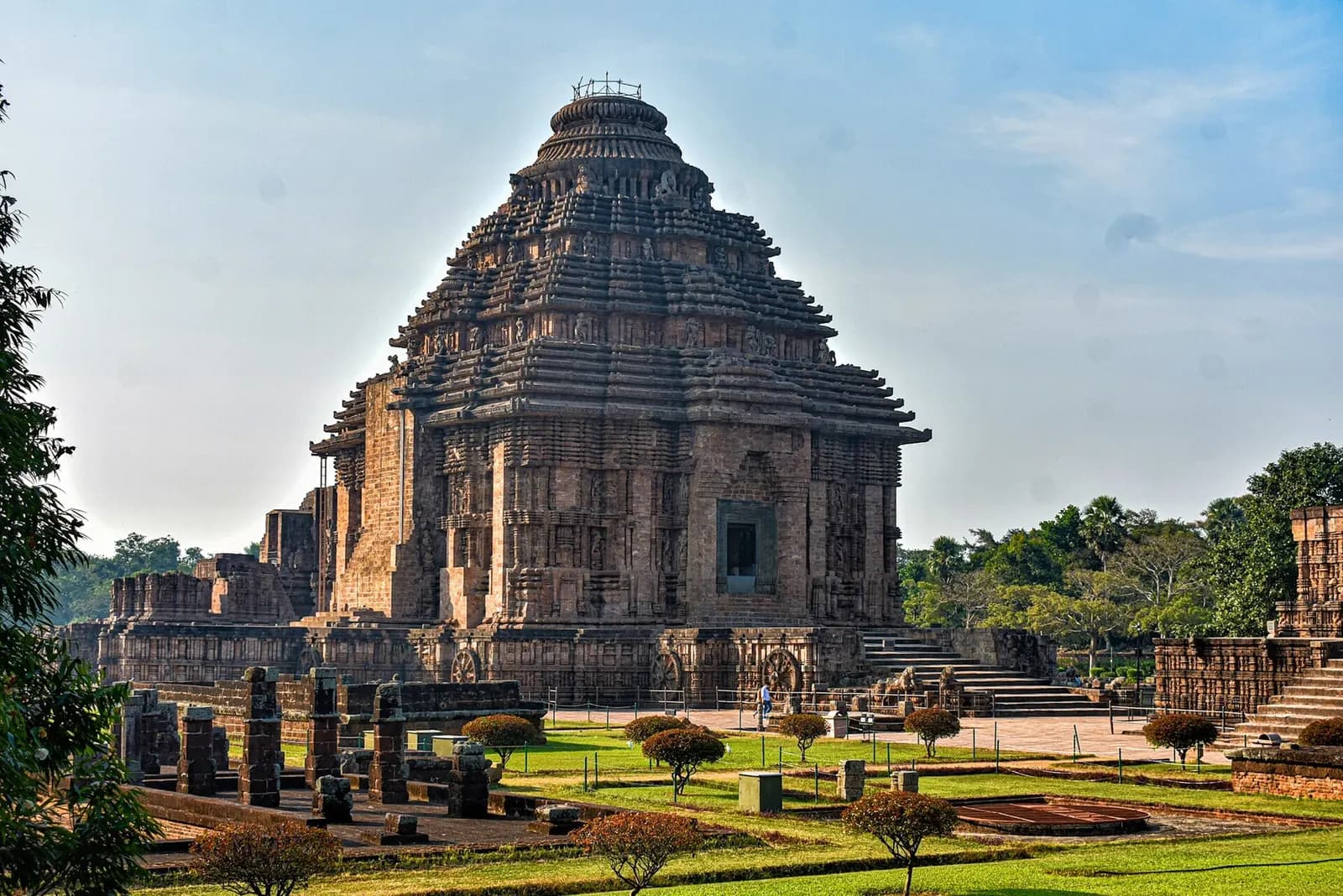 A carved stone chariot wheel on the plinth of the Sun Temple at Konark